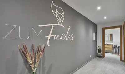 Ein Zertifikat, Auszeichnung, Logo oder anderes Dokument, das in der Unterkunft Apartment ZUM Fuchs ausgestellt ist