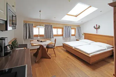 Ein Bett oder Betten in einem Zimmer der Unterkunft Filzenhof