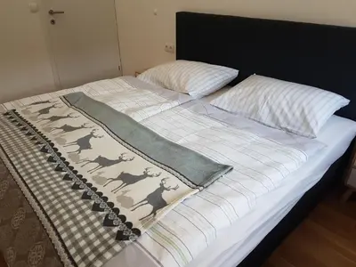 Ein Bett oder Betten in einem Zimmer der Unterkunft Ferienwohnung Rainer