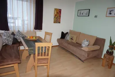 Ein Sitzbereich in der Unterkunft Apartment Kolb