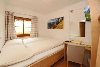 Ein Bett oder Betten in einem Zimmer der Unterkunft Riederhof