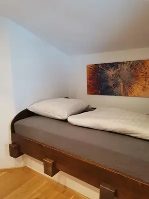 Ein Bett oder Betten in einem Zimmer der Unterkunft Bonapart
