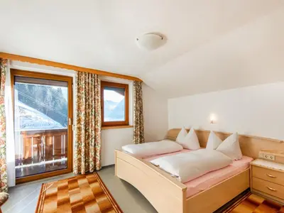 Ein Bett oder Betten in einem Zimmer der Unterkunft Chalet in Hainzenberg near Ski Slopes
