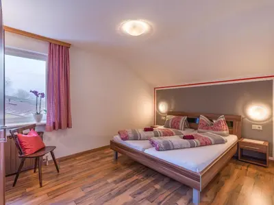 Ein Bett oder Betten in einem Zimmer der Unterkunft Alte Schmiede Talbach
