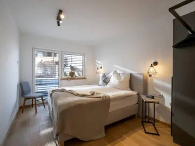 Ein Bett oder Betten in einem Zimmer der Unterkunft Ferienwohnung Tirolglück mit großem Garten