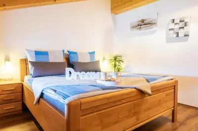 Ein Bett oder Betten in einem Zimmer der Unterkunft Starmacher Hof