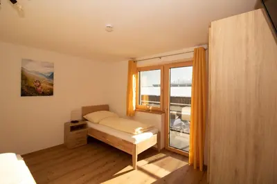 Ein Bett oder Betten in einem Zimmer der Unterkunft Apart Christof