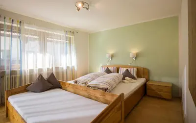 Ein Bett oder Betten in einem Zimmer der Unterkunft Apart Pfister