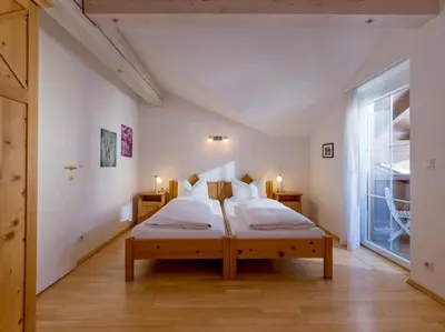 Ein Bett oder Betten in einem Zimmer der Unterkunft Ski-in, Ski-out by Apartment Managers