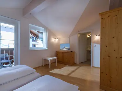 Ein Bett oder Betten in einem Zimmer der Unterkunft Ski-in, Ski-out by Apartment Managers