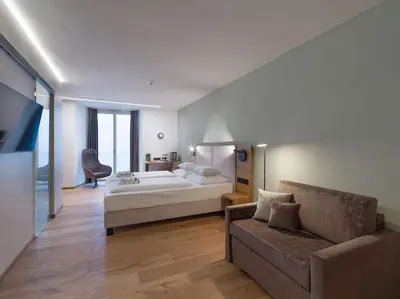 Ein Bett oder Betten in einem Zimmer der Unterkunft Platzhirsch Kufstein