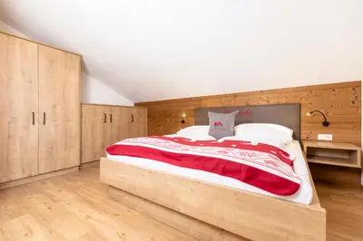 Ein Bett oder Betten in einem Zimmer der Unterkunft Herzstück Appartements Zillertal