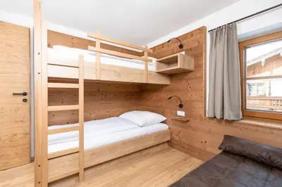 Ein Bett oder Betten in einem Zimmer der Unterkunft Herzstück Appartements Zillertal