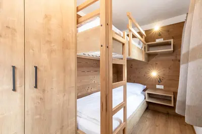 Ein Bett oder Betten in einem Zimmer der Unterkunft Herzstück Appartements Zillertal