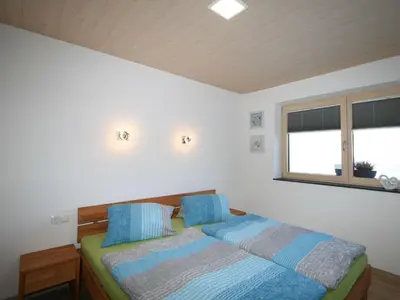 Ein Bett oder Betten in einem Zimmer der Unterkunft Apartment Nina by Interhome