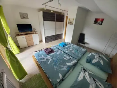 Ein Bett oder Betten in einem Zimmer der Unterkunft Ferienwohnung Bergtroll