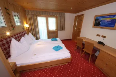 Ein Bett oder Betten in einem Zimmer der Unterkunft TALHEIMER Grias di & Hoamat since 1958 inklusive Therme TAUERN SPA & Jokercard