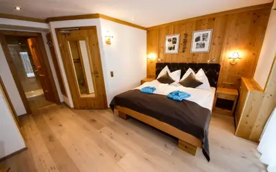 Ein Bett oder Betten in einem Zimmer der Unterkunft TALHEIMER Grias di & Hoamat since 1958 inklusive Therme TAUERN SPA & Jokercard
