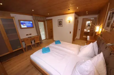 Ein Bett oder Betten in einem Zimmer der Unterkunft TALHEIMER Grias di & Hoamat since 1958 inklusive Therme TAUERN SPA & Jokercard