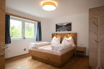 Ein Bett oder Betten in einem Zimmer der Unterkunft Ferienhaus zur Kundler Klamm WILD012