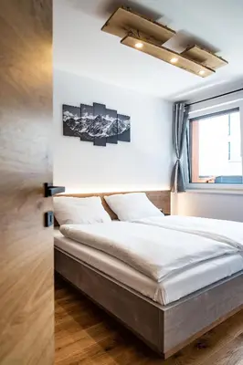 Ein Bett oder Betten in einem Zimmer der Unterkunft Apartment Griass di Fügen