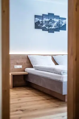 Ein Bett oder Betten in einem Zimmer der Unterkunft Apartment Griass di Fügen