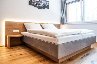 Ein Bett oder Betten in einem Zimmer der Unterkunft Apartment Griass di Fügen