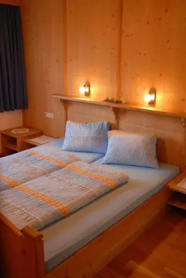 Ein Bett oder Betten in einem Zimmer der Unterkunft Kashütte