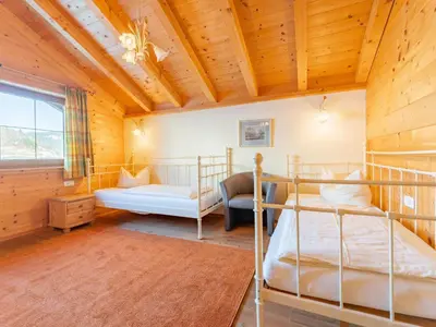 Ein Bett oder Betten in einem Zimmer der Unterkunft Chalet Wildschönau