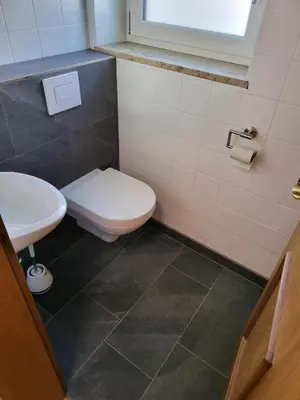 Ein Badezimmer in der Unterkunft Alpen Chalet Bramberg