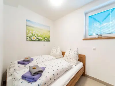 Ein Bett oder Betten in einem Zimmer der Unterkunft Apartment in Hollersbach near Ski Lift