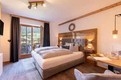 Ein Bett oder Betten in einem Zimmer der Unterkunft Pension Edelweiss