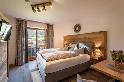 Ein Bett oder Betten in einem Zimmer der Unterkunft Pension Edelweiss