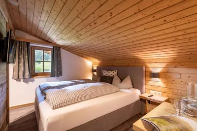Ein Bett oder Betten in einem Zimmer der Unterkunft Pension Edelweiss