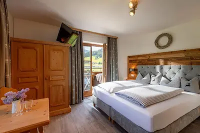 Ein Bett oder Betten in einem Zimmer der Unterkunft Pension Edelweiss
