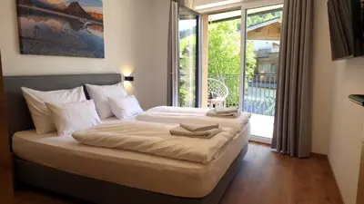Ein Bett oder Betten in einem Zimmer der Unterkunft BERGZEIT Appartements