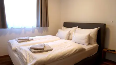 Ein Bett oder Betten in einem Zimmer der Unterkunft BERGZEIT Appartements