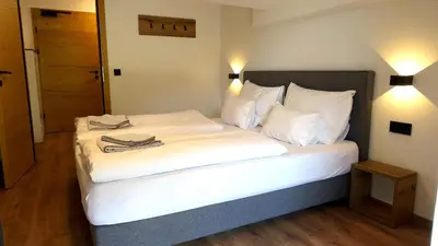 Ein Bett oder Betten in einem Zimmer der Unterkunft BERGZEIT Appartements