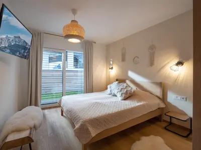 Ein Bett oder Betten in einem Zimmer der Unterkunft Ferienwohnung 
