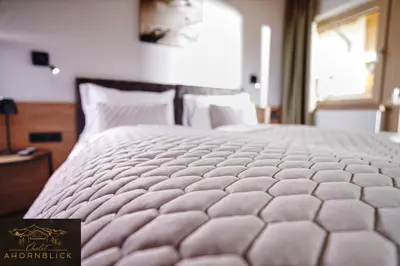 Ein Bett oder Betten in einem Zimmer der Unterkunft Chalet Ahornblick