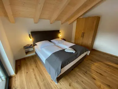 Ein Bett oder Betten in einem Zimmer der Unterkunft Our's Living Penthouse - private Sauna - near Kitzbüheler Alpen ski lift
