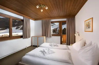 Ein Bett oder Betten in einem Zimmer der Unterkunft Appartementhaus Tannenberg
