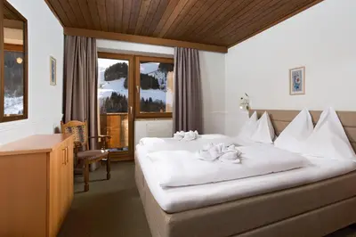 Ein Bett oder Betten in einem Zimmer der Unterkunft Appartementhaus Tannenberg
