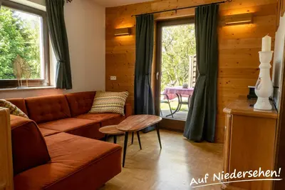 Ein Sitzbereich in der Unterkunft Ferienwohnung Auf Niedersehen - 8 Personen - Kitzbüheler Alpen - Höhe Tauern NP