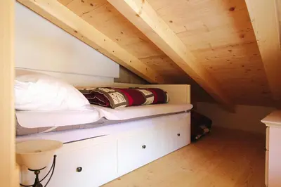 Ein Bett oder Betten in einem Zimmer der Unterkunft Chalet in Königsleiten with Wellness & Alps View
