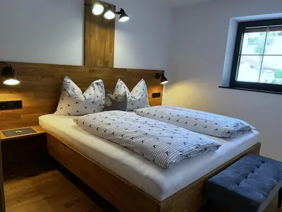 Ein Bett oder Betten in einem Zimmer der Unterkunft Ferienwohnungen Kirchenwirt
