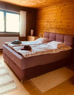 Ein Bett oder Betten in einem Zimmer der Unterkunft Ferienhaus Ella