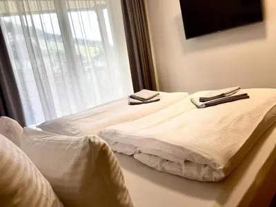Ein Bett oder Betten in einem Zimmer der Unterkunft Bergzeit Apartments right on the ski slope