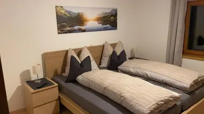 Ein Bett oder Betten in einem Zimmer der Unterkunft Ferienwohnung Dornau