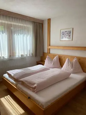 Ein Bett oder Betten in einem Zimmer der Unterkunft Appartementhaus Hubert